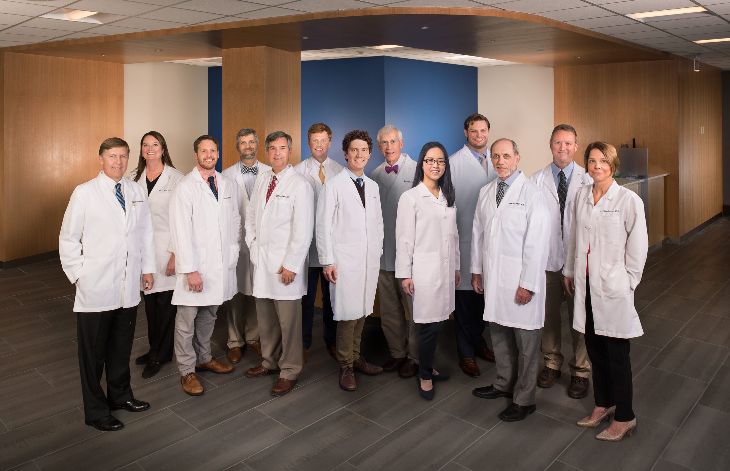 group of 14 doctors in white coats